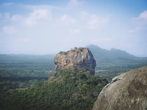 Sigiriya rock fortress rising above the jungle canopy