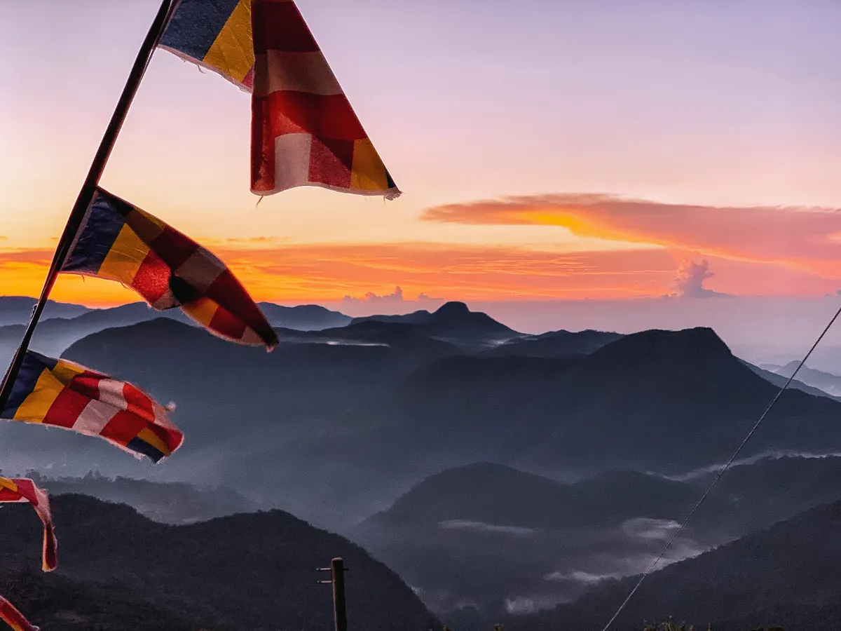 Sunrise from the summit of Adam’s Peak, the mountain’s triangular shadow cast on the clouds