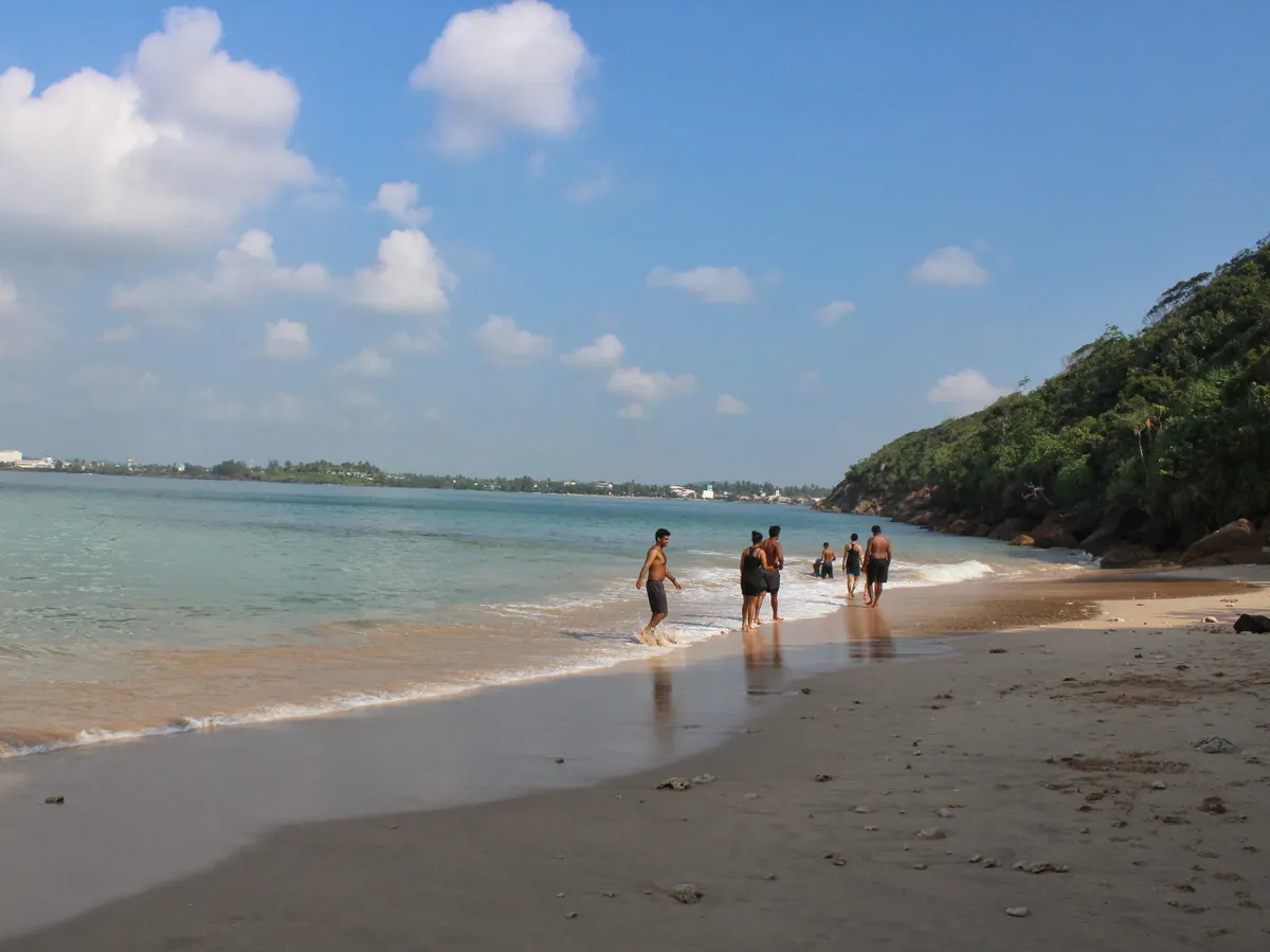 The hidden jade-water cove of Jungle Beach below Rumassala hill