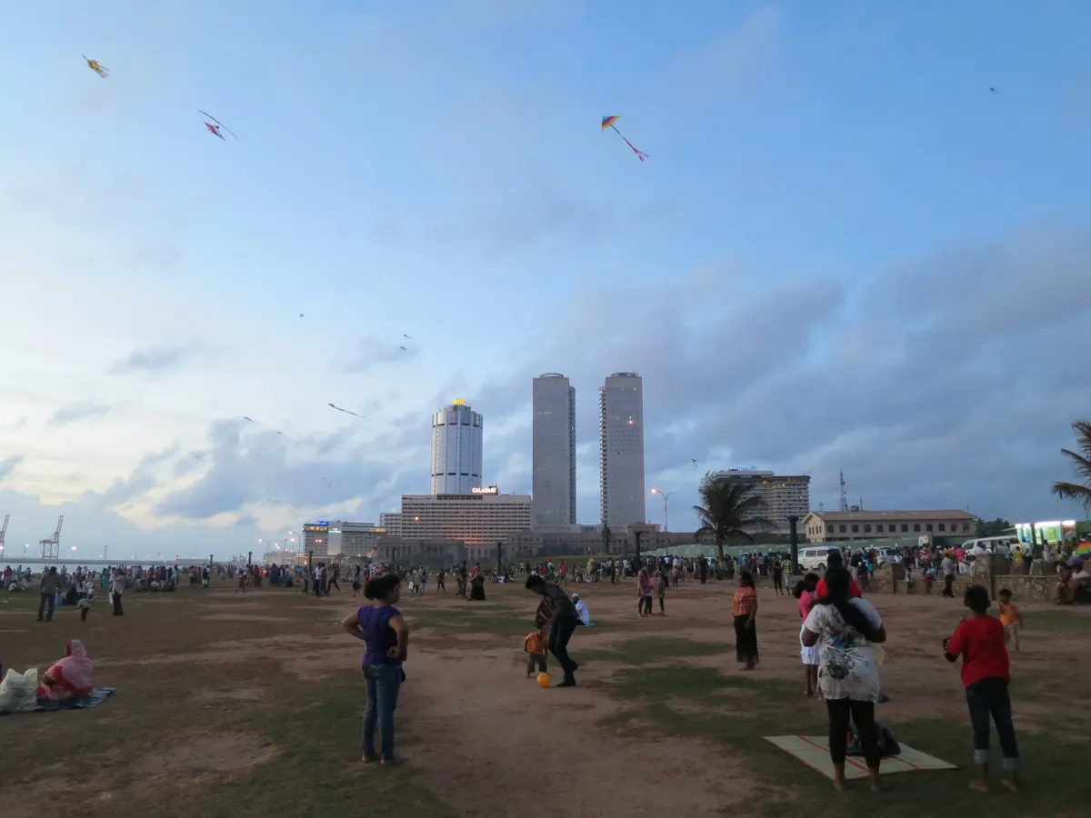 Kites and evening crowds on Galle Face Green at sunset, Colombo