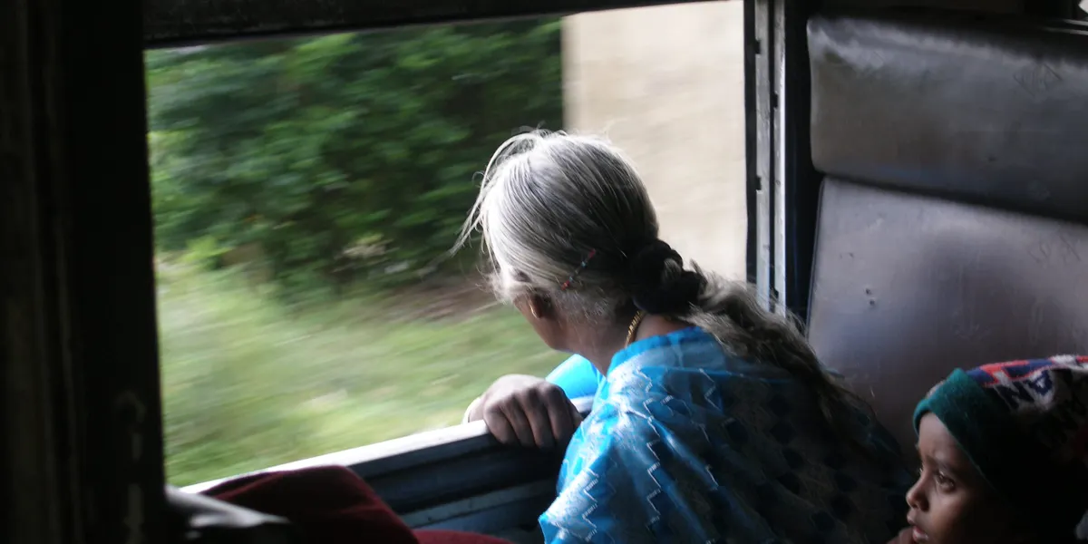 Passengers gazing from the window of the upcountry train