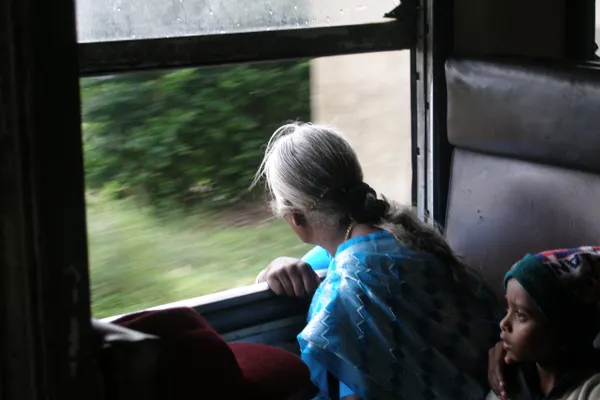 Passengers gazing from the window of the upcountry train